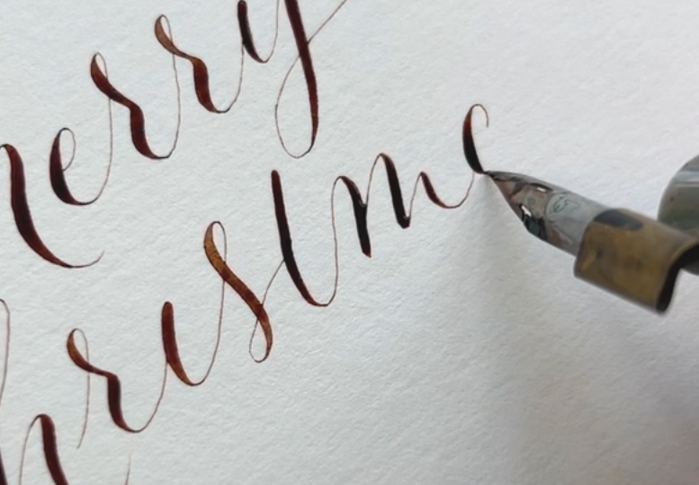 Close up of live calligraphy for a brand activation