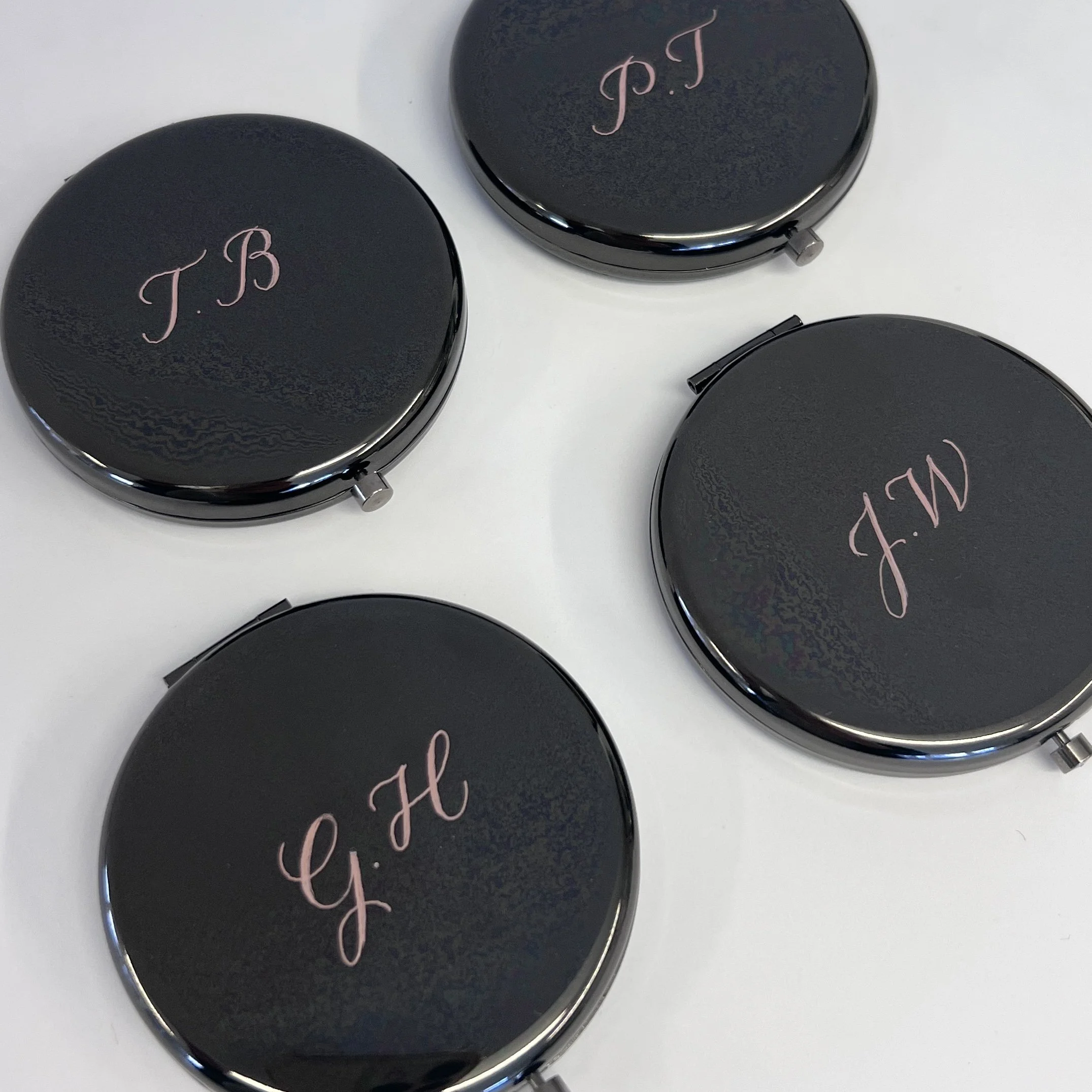 Hand-engraved compact mirrors personalised with initials for gifting
