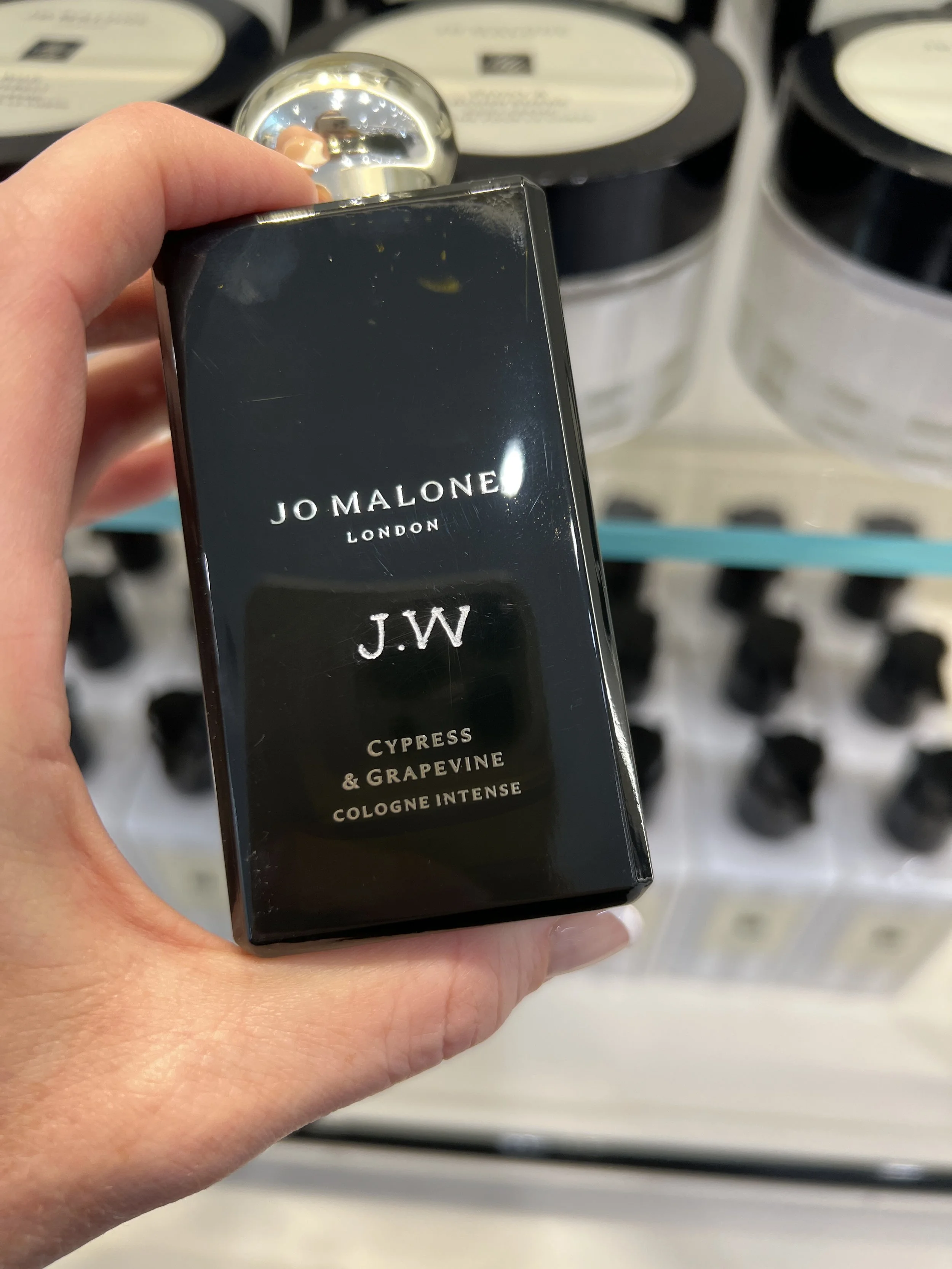 Hand engraved Jo Malone perfume bottle at a luxury brand activation