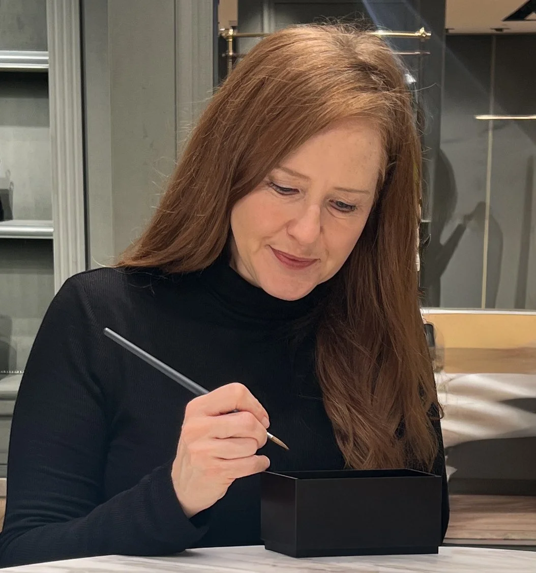 On-site product painting being carried out during a luxury brand activation event