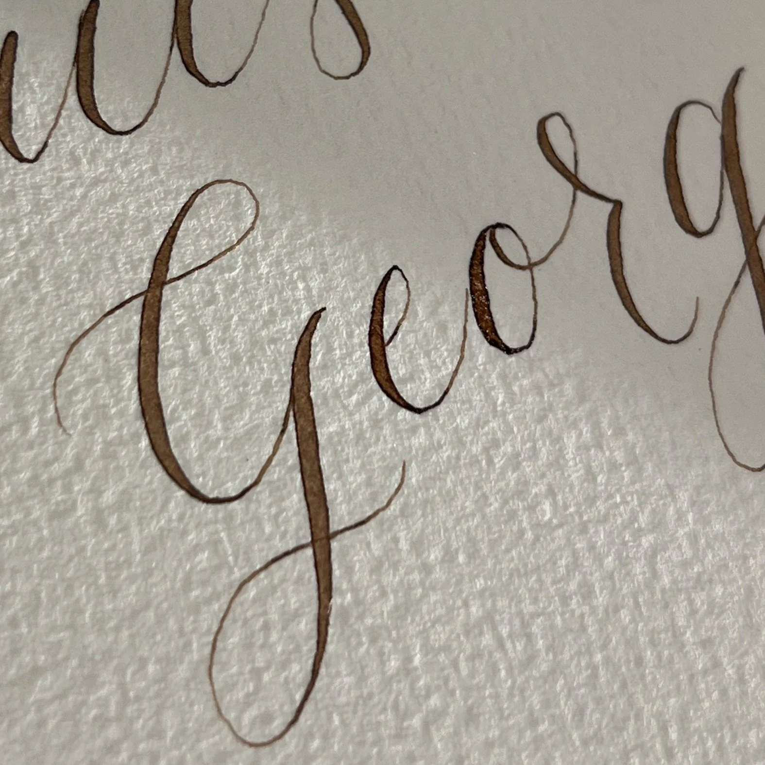 Detail of modern calligraphy lettering suited to contemporary luxury brand projects