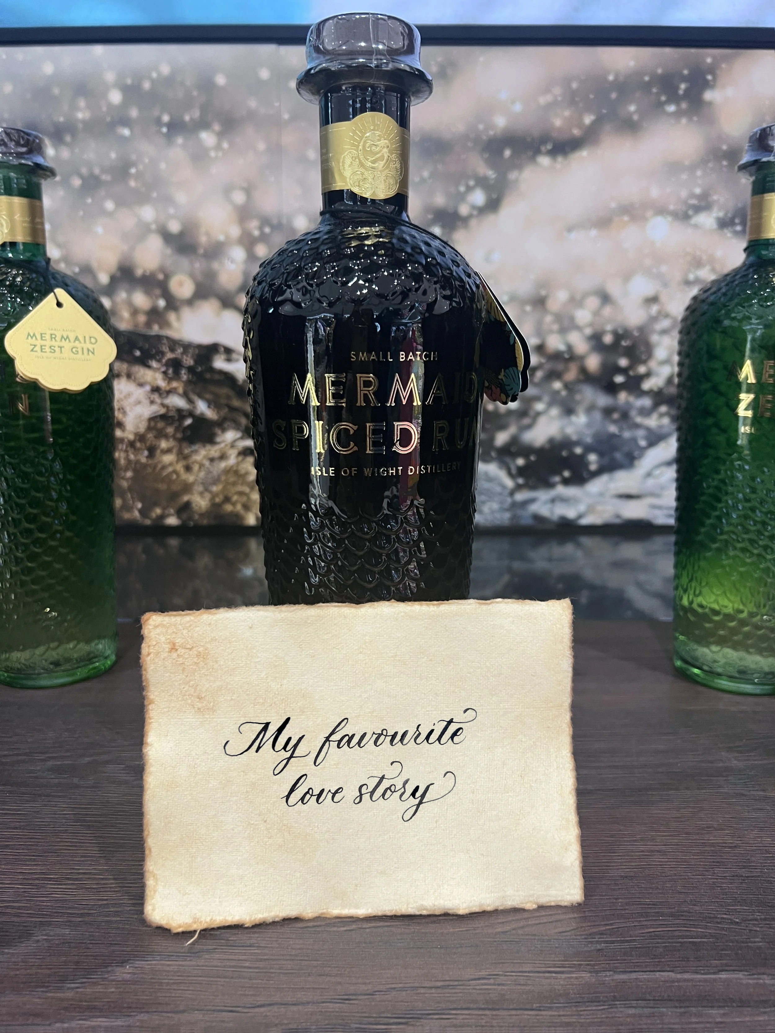 Live calligraphy on gift card at Mermaid Gin brand activation