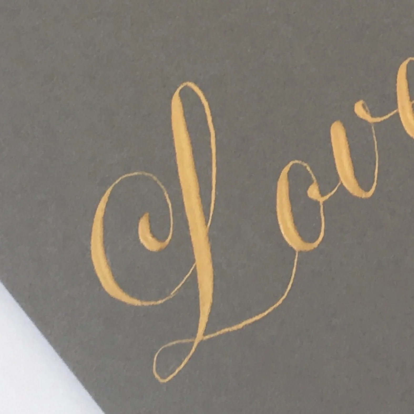 Classic calligraphy script detail suitable for heritage and luxury brand applications