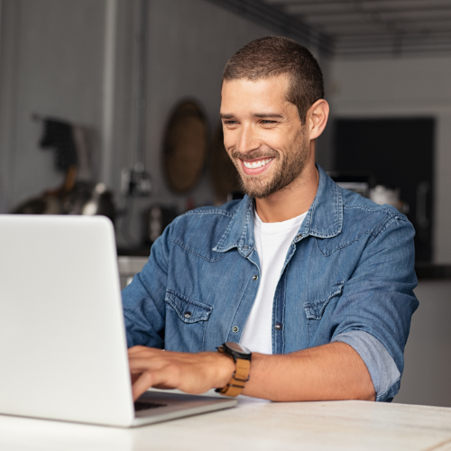 man with laptop on valpak website