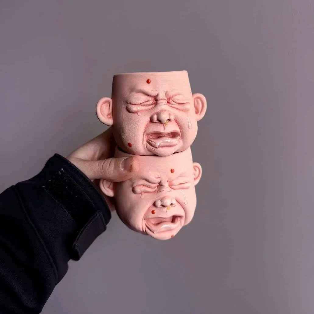 BabyFace Mugs: Stoneware, cone 6 firing, underglaze and glaze 
Hand-sculpted ceramic cups