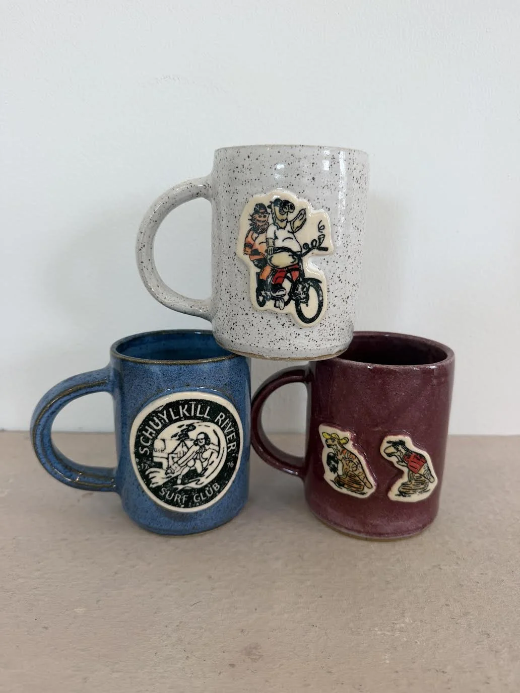 BabyFace Studio:
Hand thrown Philly Mugs- stoneware, cone 6, underglaze, glaze, original custom screen printed decals 