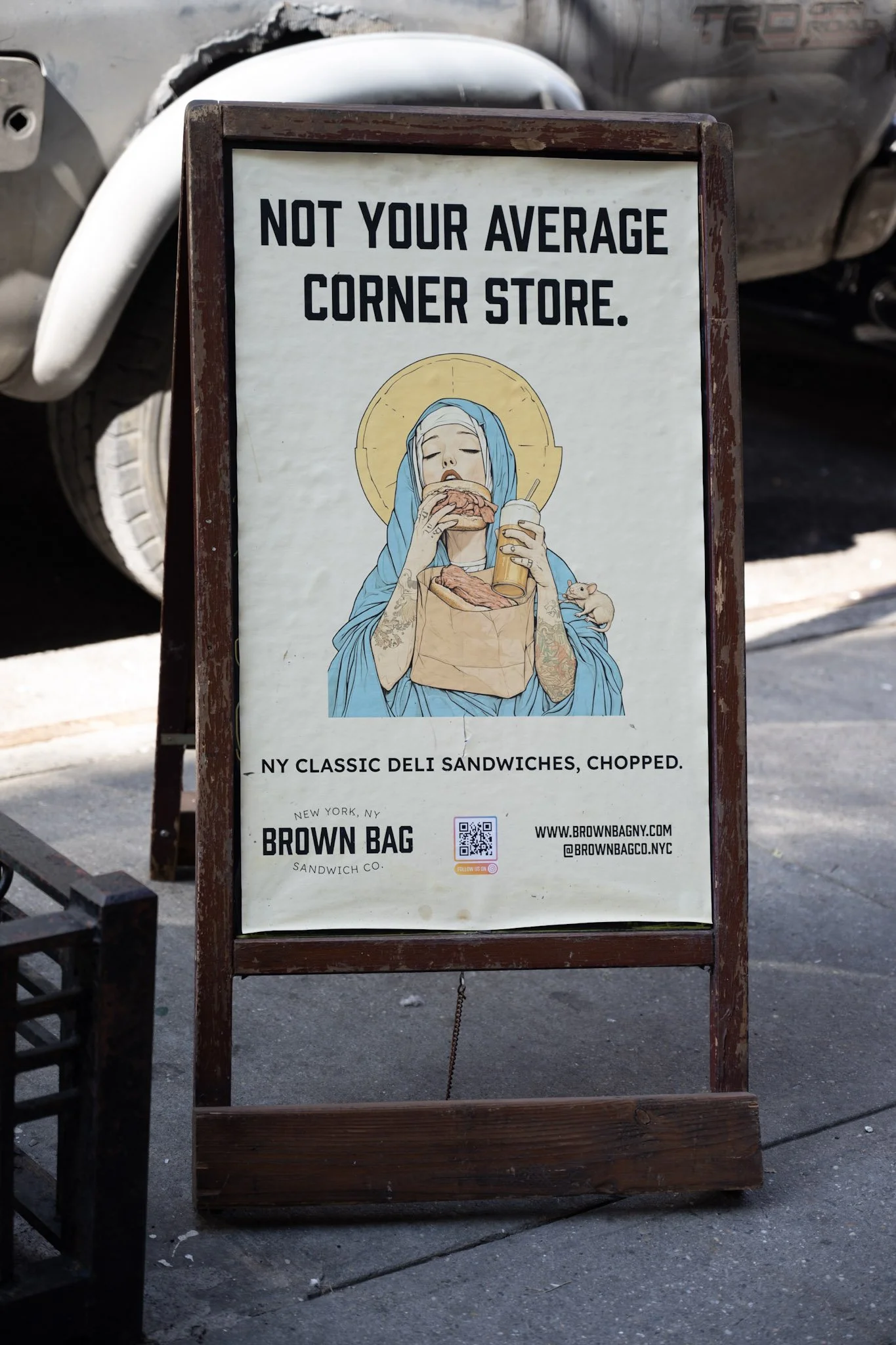 Sign outside of Brown Bag's Flatiron location reading "Not Your Average Corner Store".