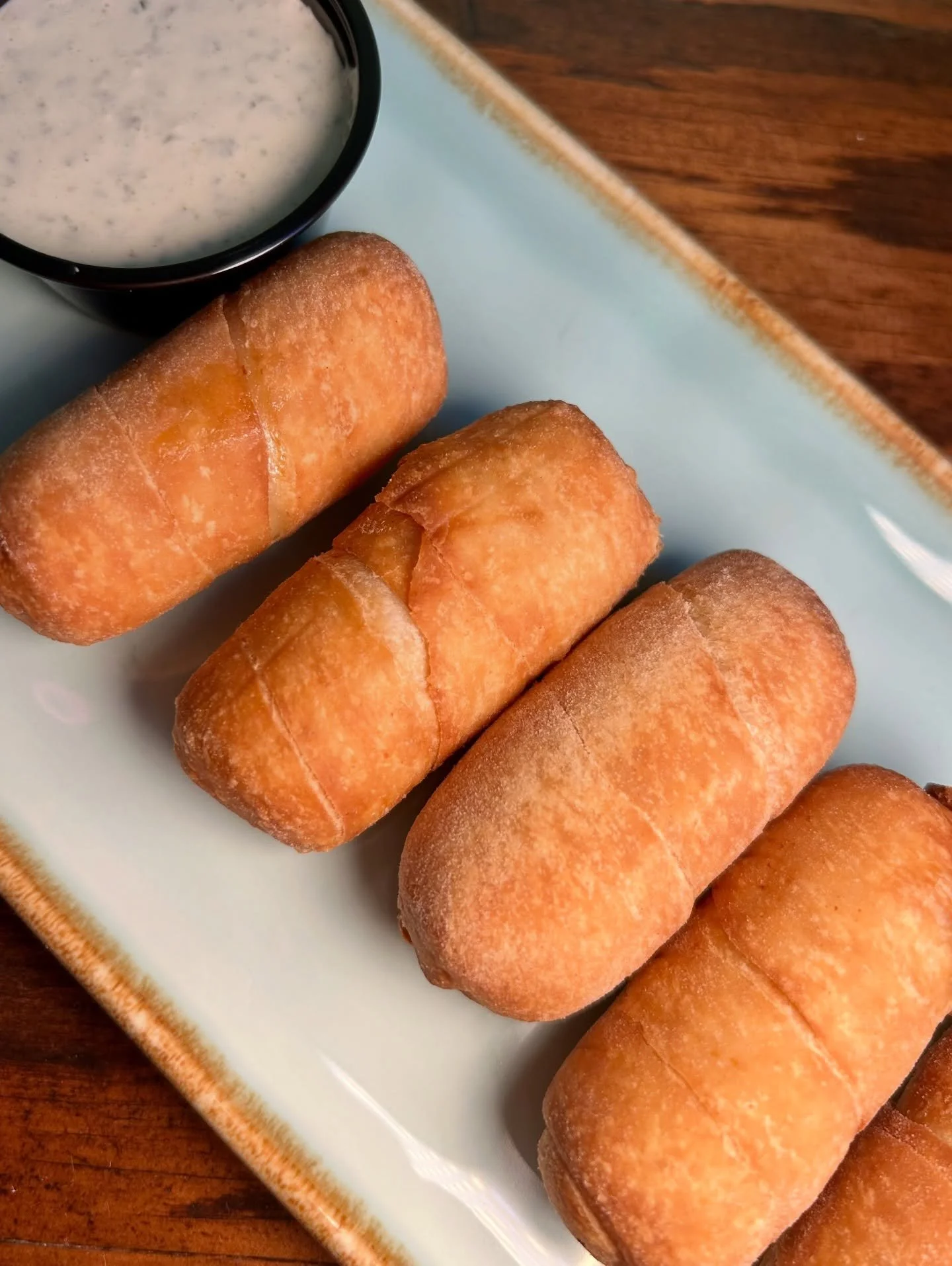 Ahhhhh&hellip; Golden, crispy on the outside with melty, stretchy cheese on the inside 🤤🧀

Our teque&ntilde;os are best enjoyed fresh out of the fryer and dipped in our homemade cilantro garlic sauce. Come grab an order (or two) this weekend!
&bull