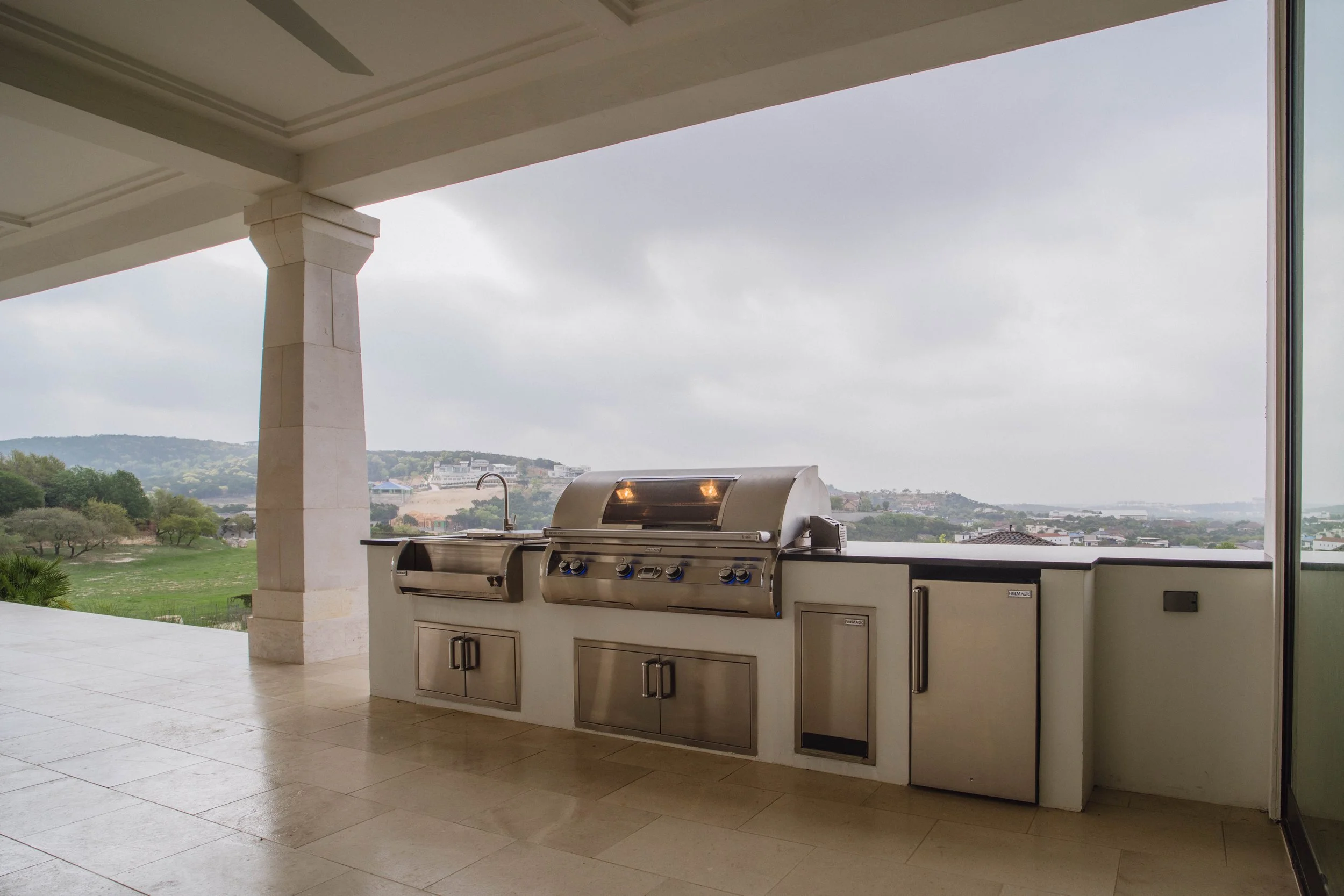 High-end stainless steel outdoor kitchen appliances and storage detail in San Antonio by Cozy Fireplace and Patio