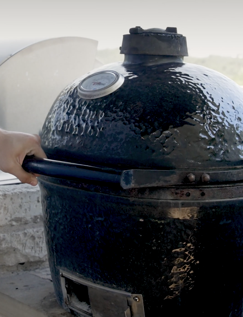 Primo ceramic charcoal grill in a custom outdoor kitchen by Cozy Fireplace + Patio, San Antonio