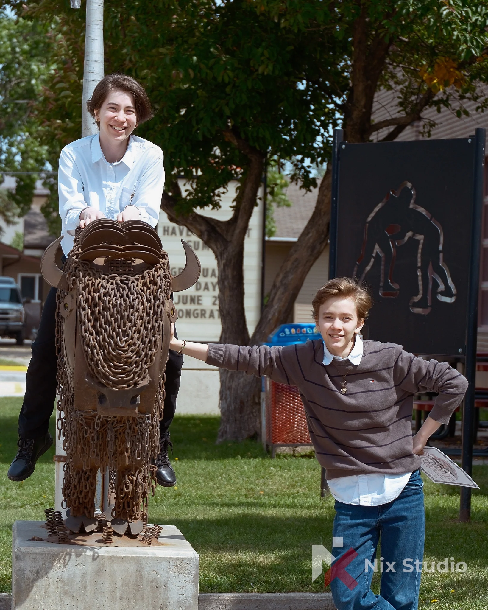 Sibling photos in-front of Morden,MB Colligate 