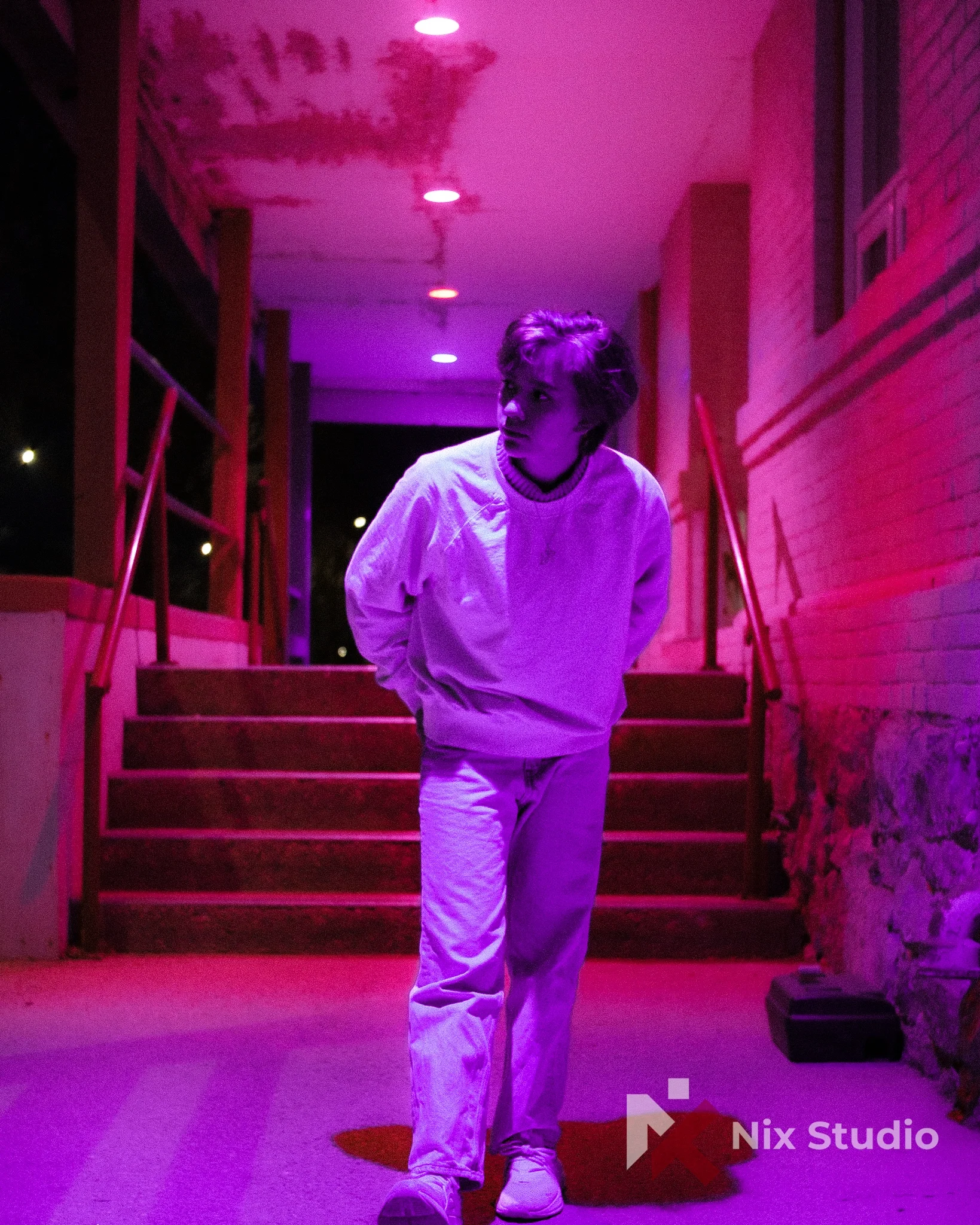 Portrait of man by neon lights in Morden, Mb