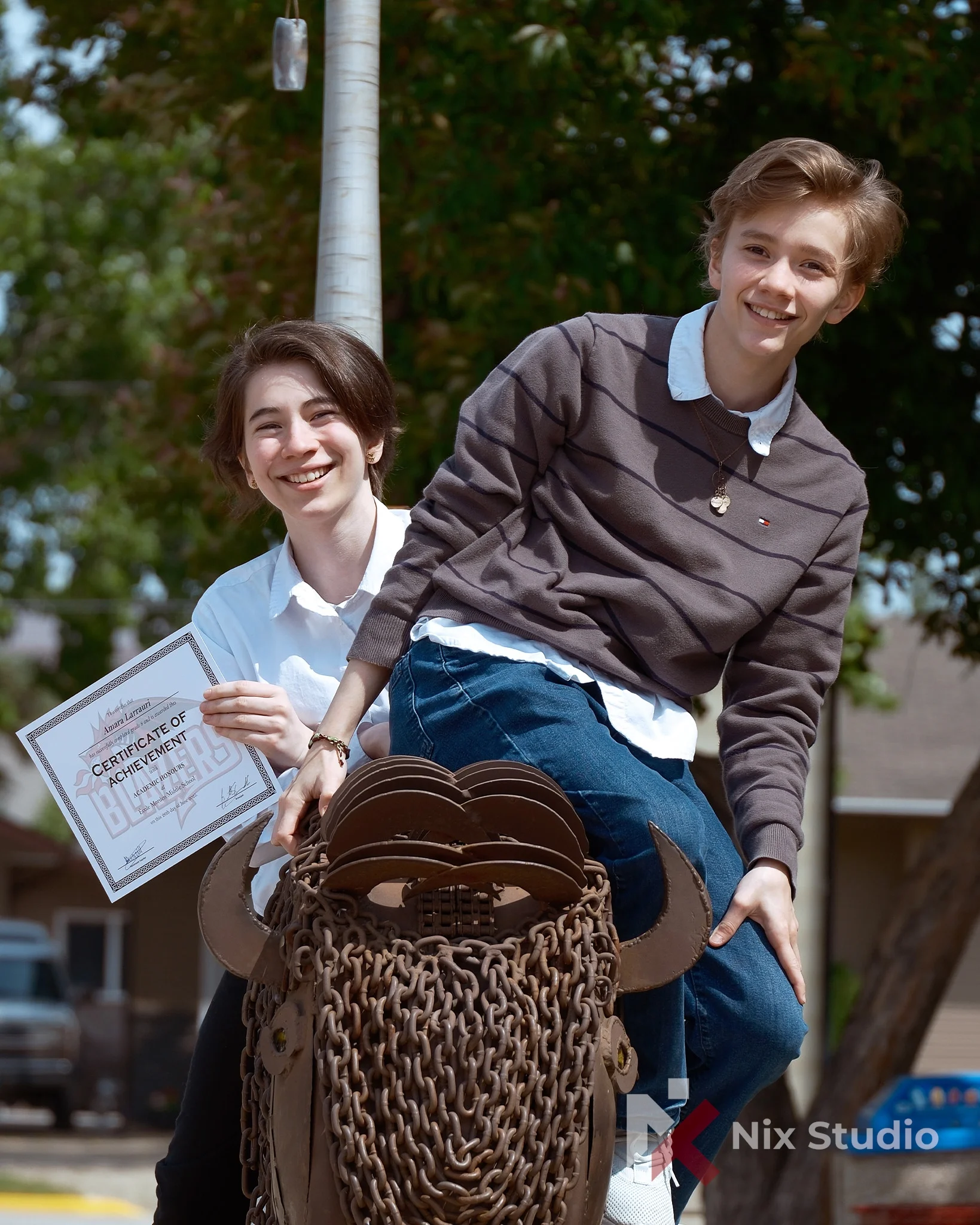 Sibling photos in-front of Morden,MB Colligate 