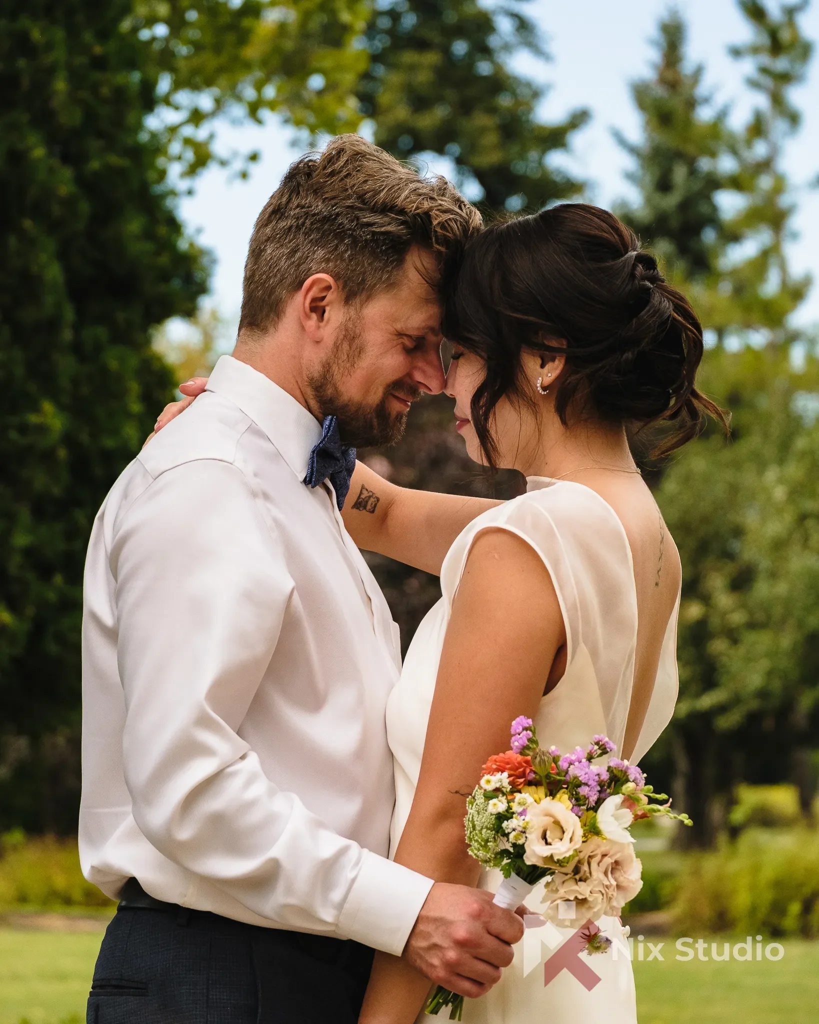 Portrait of a newlywed couple captured by Dunixi Larrauri in Morden Manitoba