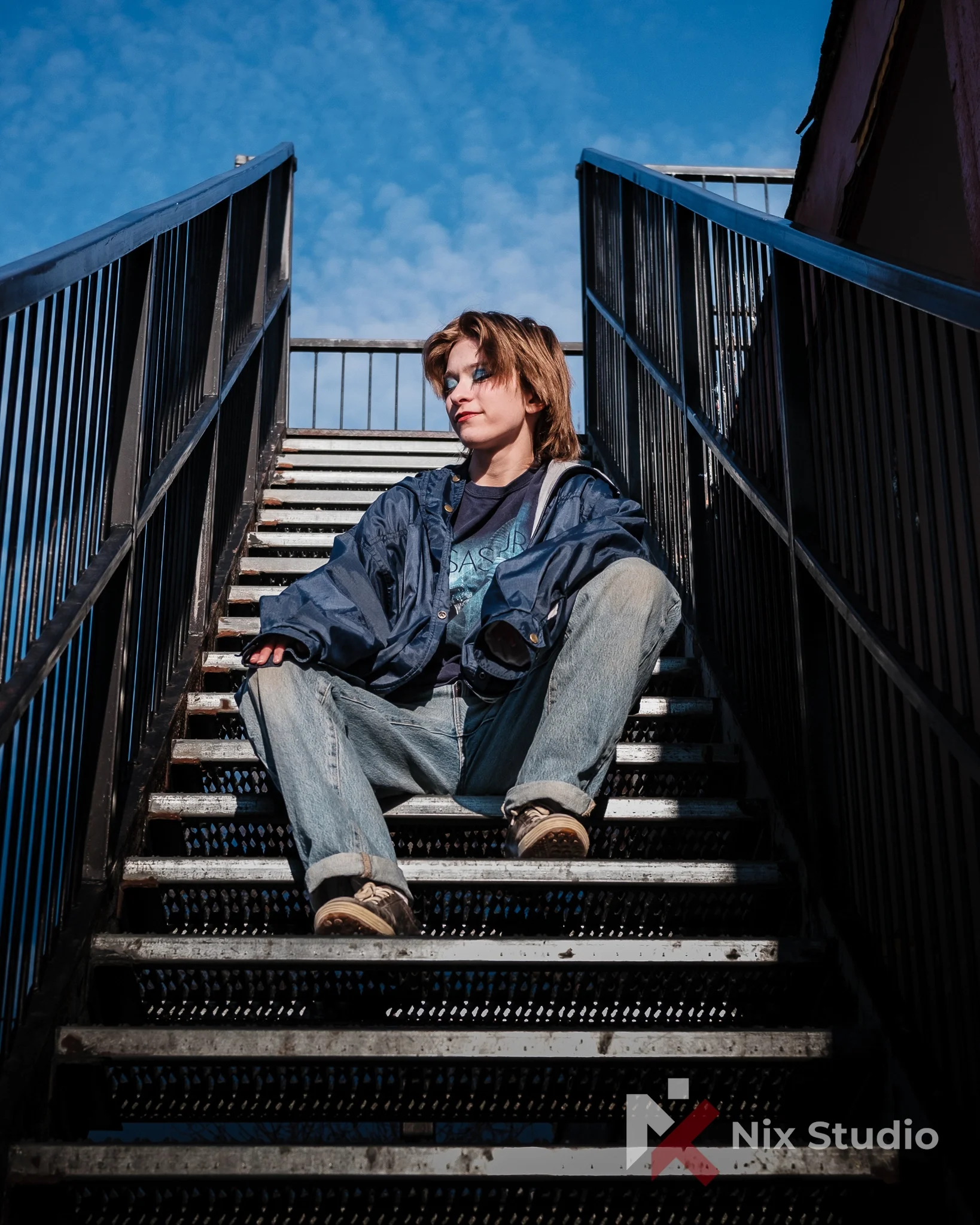 Portrait of woman on the stairs by bar in Morden, MB