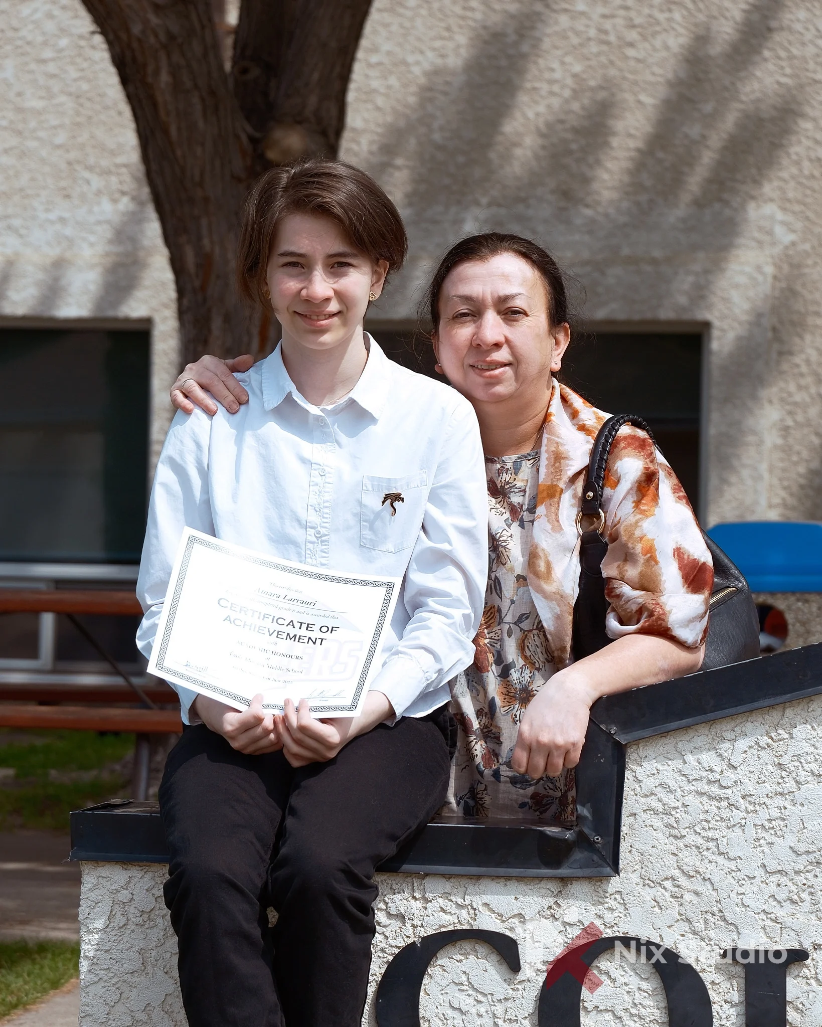 Family photo of mother and daughter after graduation