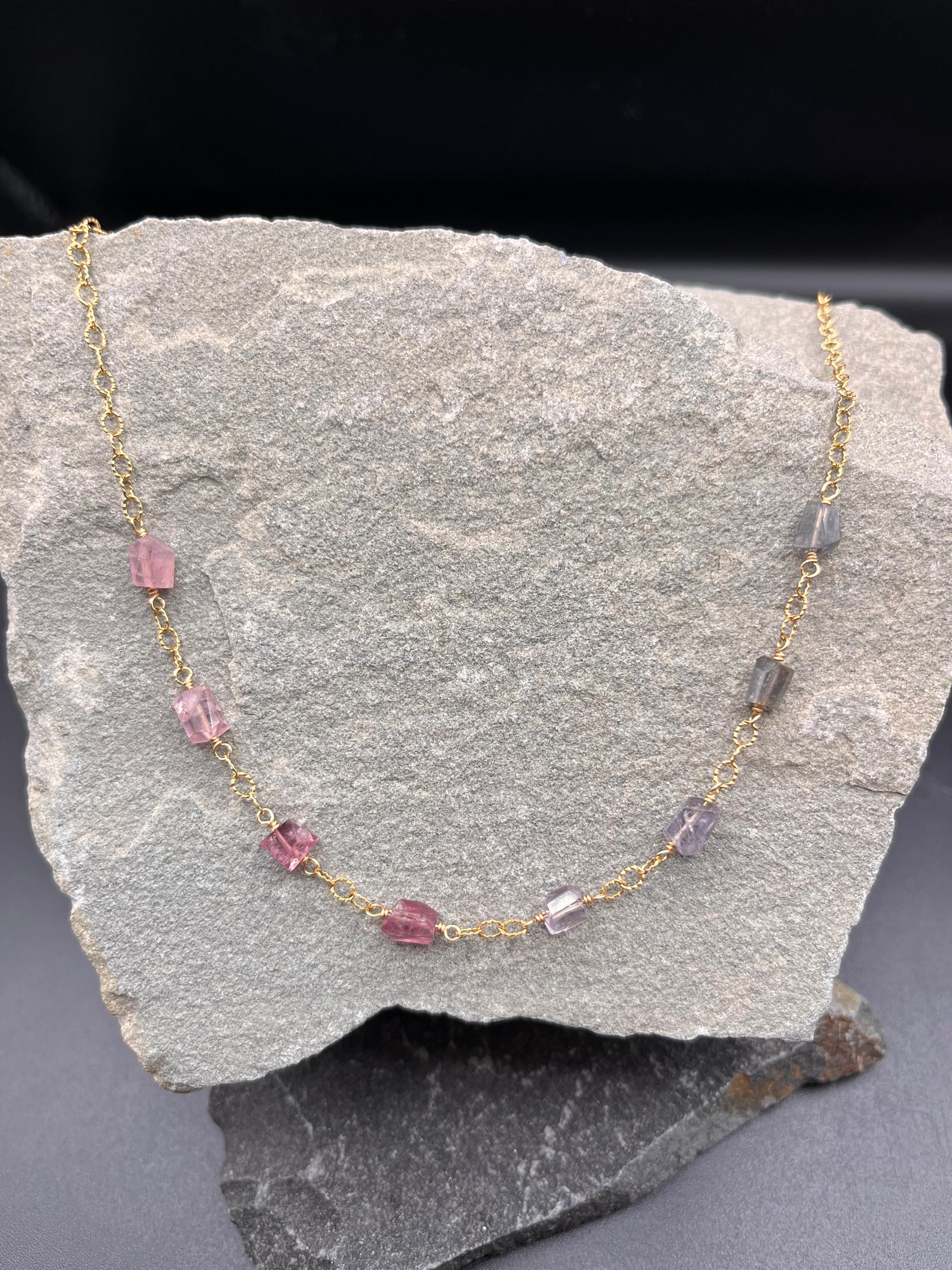 Pink spinel chunks on gold
