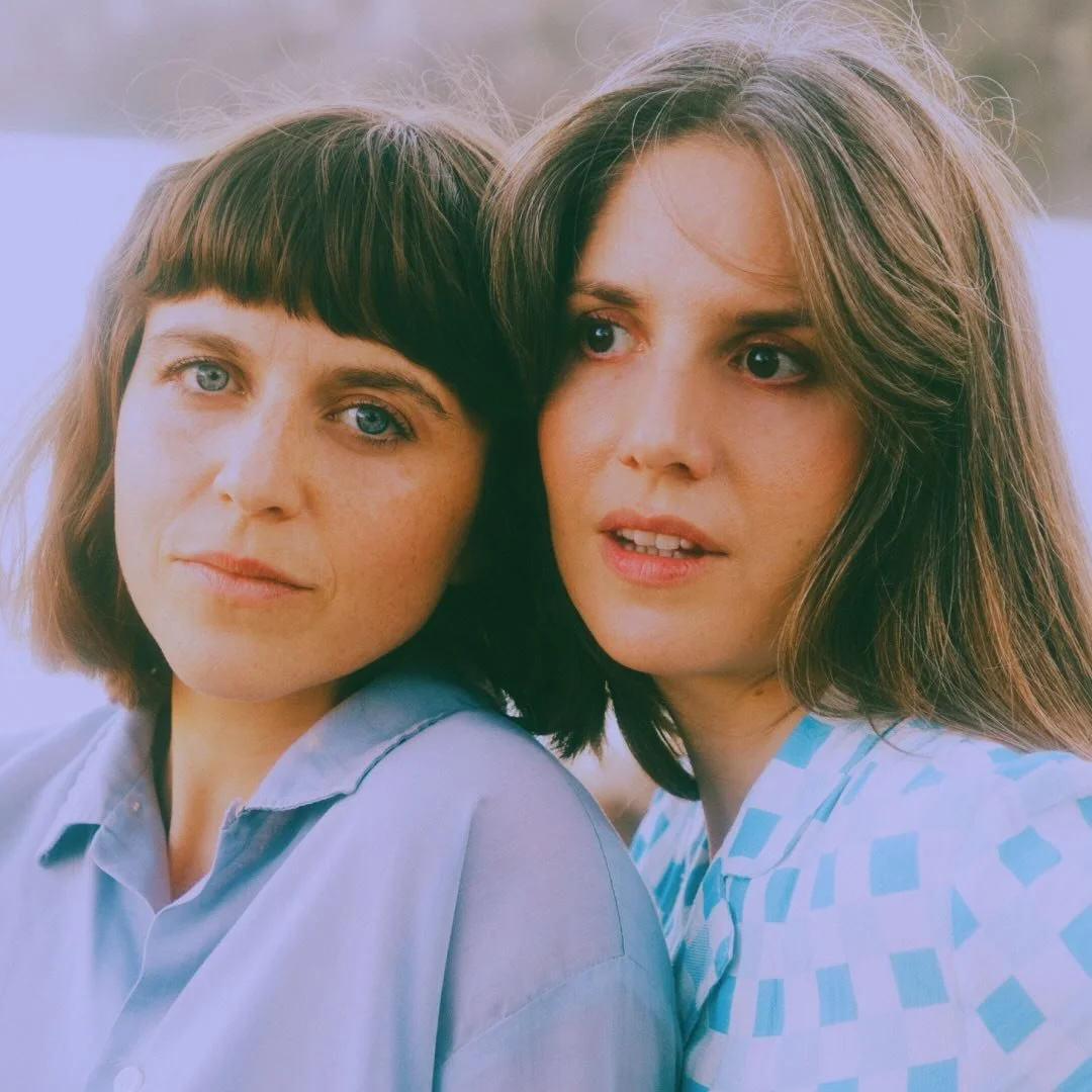 Both members of Other Vessels stand close together outdoors, looking toward the camera with calm expressions.