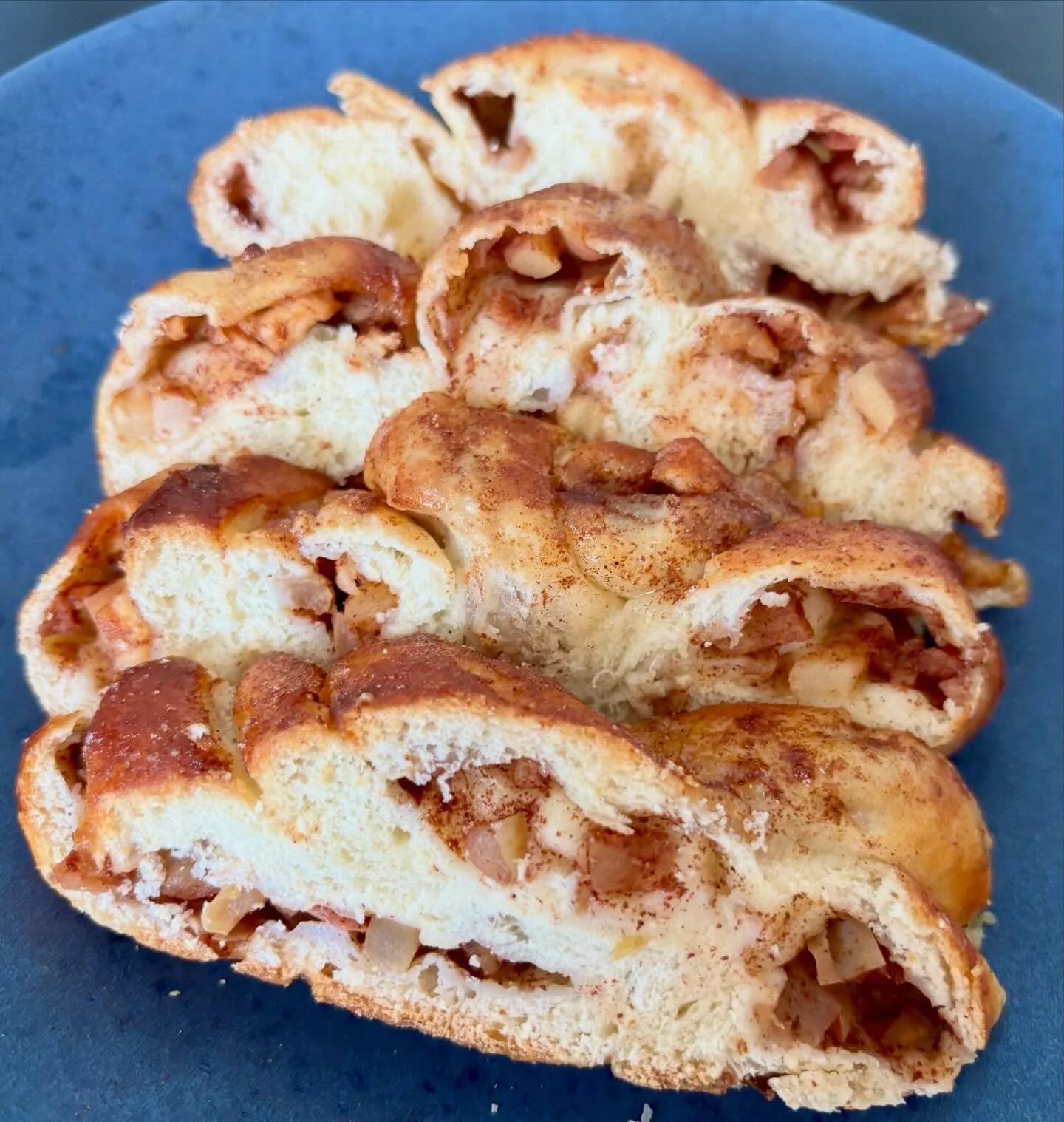 Our Apple Cinnamon Mini Challah 🍎 is a farmers market and coffee shop favorite around Denver.

We roll out soft challah dough and stuff each strand with diced apples and cinnamon sugar before braiding. 

Sweet, cinnamon-y, and dangerously easy to de
