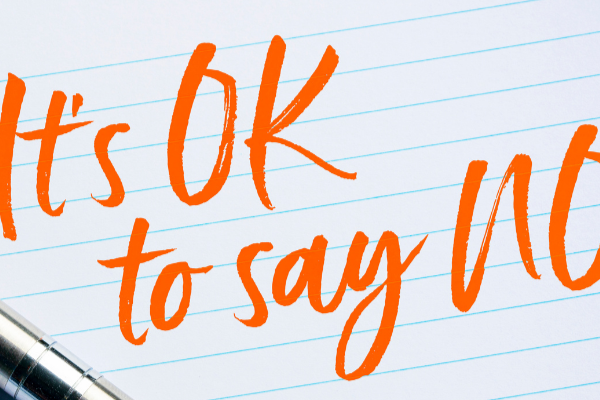 Words written in orange ink that say it's ok to say no.