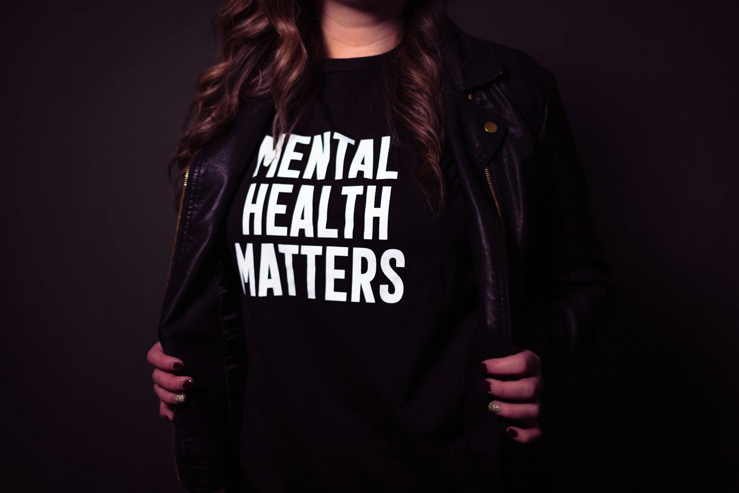 Woman wearing a T-shirt that says mental health matters.