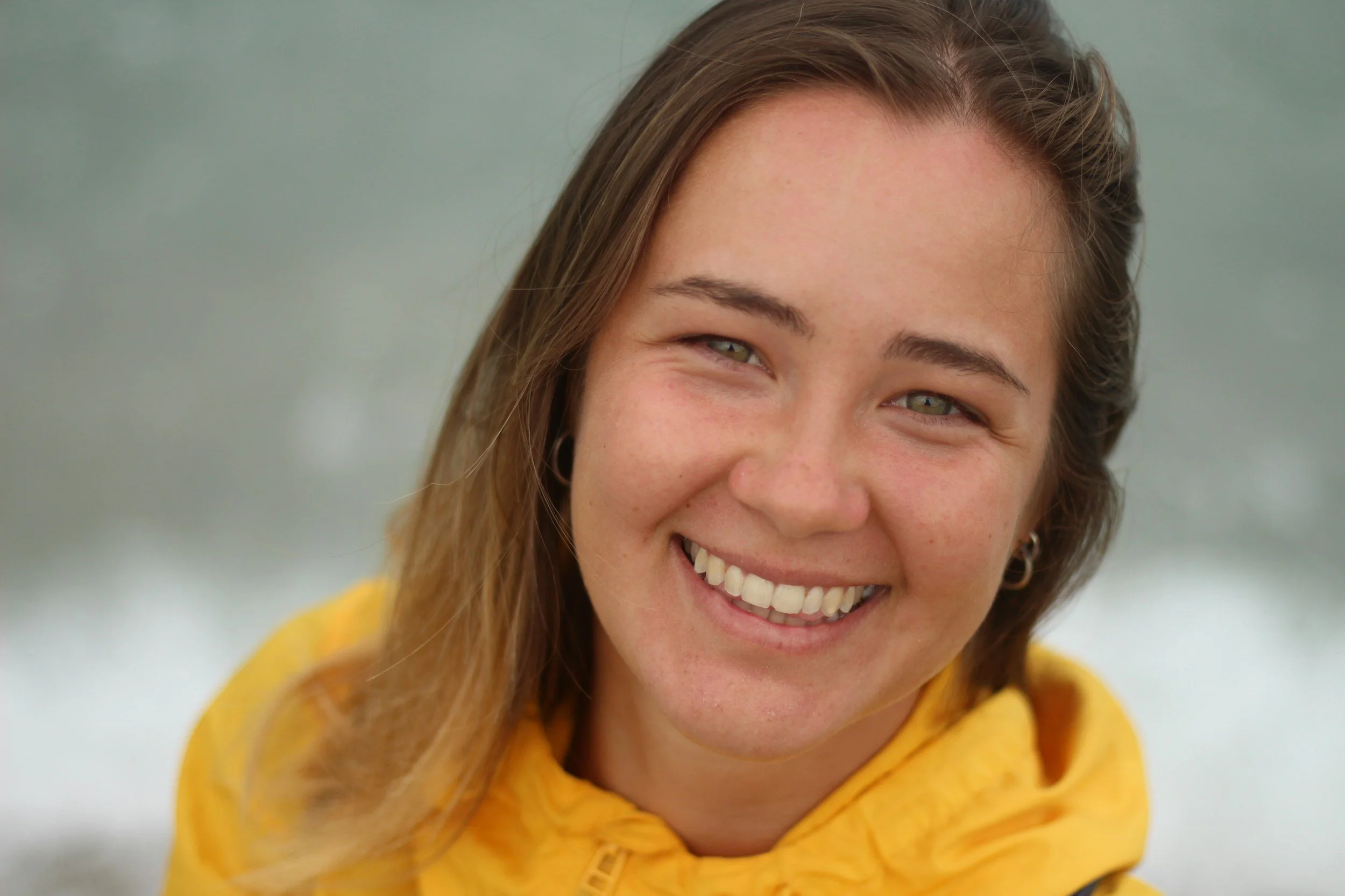 Close up picture of a mom smiling.