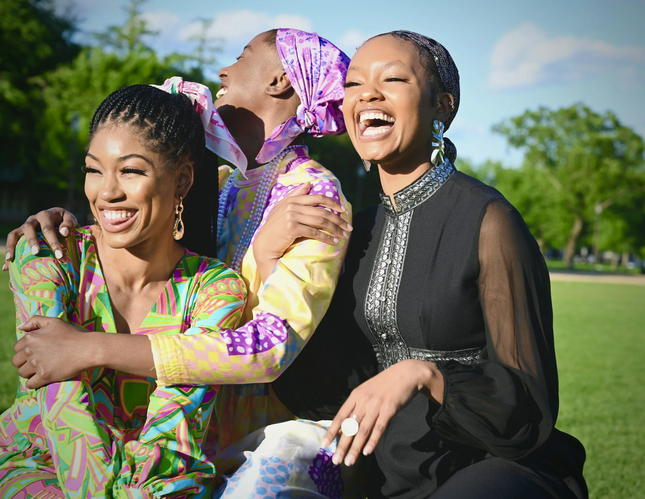Three Christian moms dressed up and laughing outside.