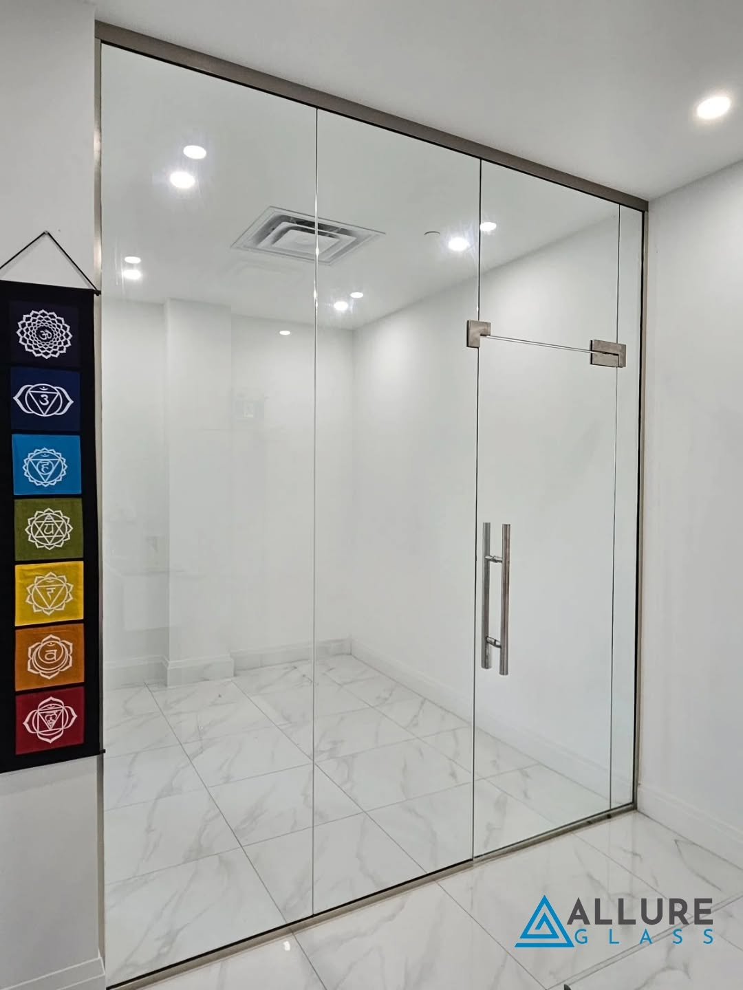 Client wanted to enclose the open space and turn it into an office.  We installed this office glass enclosure and it has completely transformed the place.  We used 12mm clear tempered glass with channel all around to secure the panels.  Door has soft