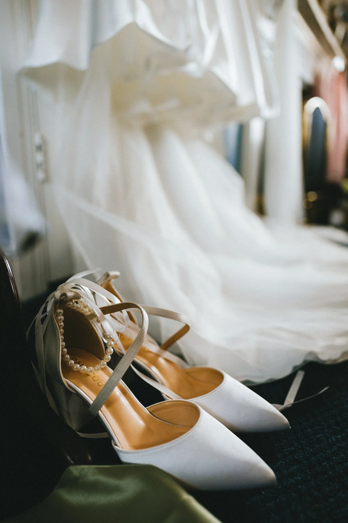 Bride's wedding dress and heels detail shot during getting ready. Wedding Photography packages.
