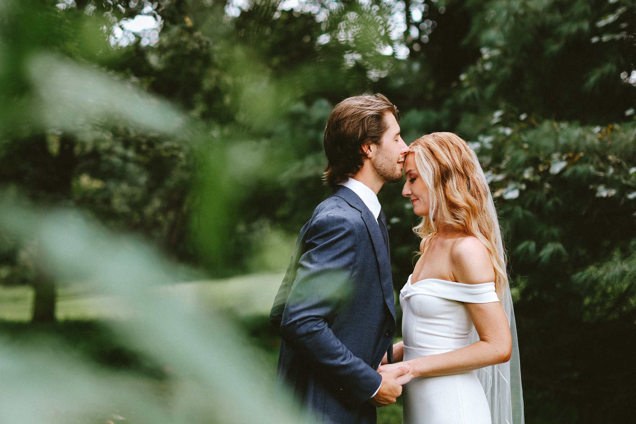 Bride and groom sharing a romantic kiss during outdoor portraits, Love Story By Aira Maryland