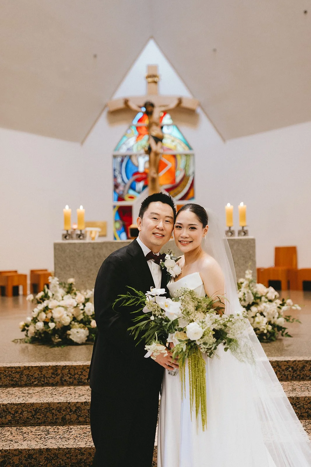 Yanika and Jong posing together after church wedding ceremony