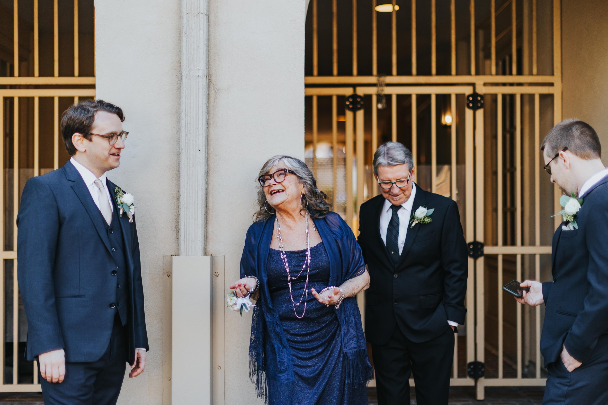 groom and his family talk to each other before ceremony