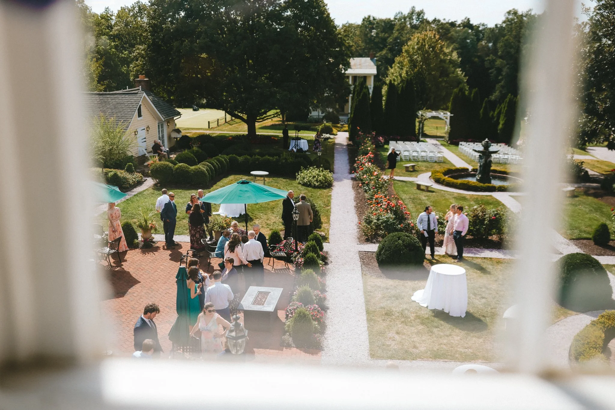Aerial view of Antrim 1844 wedding venue gardens with guests during cocktail hour, Taneytown Maryland wedding photography