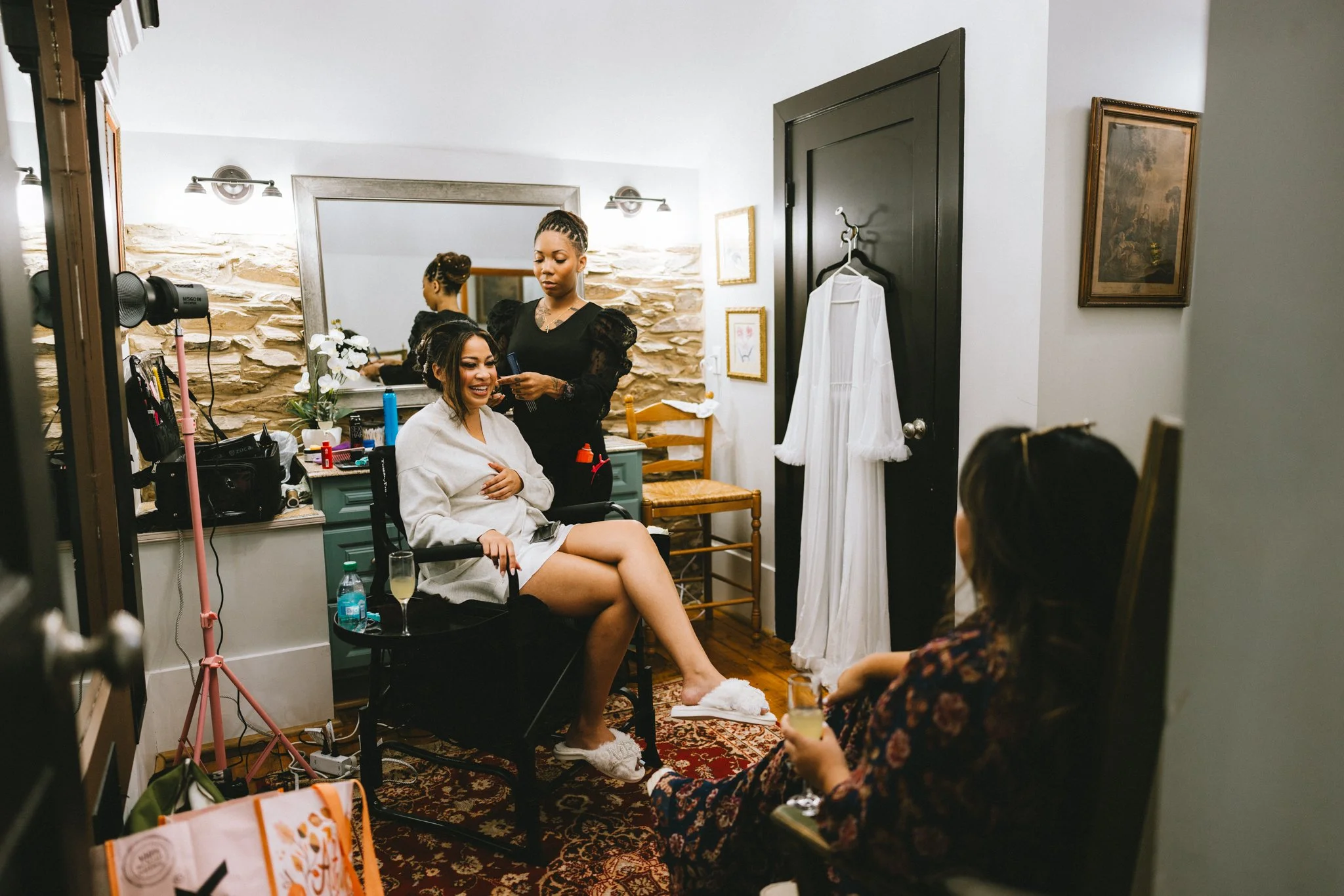 Bride laughing during hair and makeup on her wedding morning at Shiloh Manor Farm, Purcellville Virginia