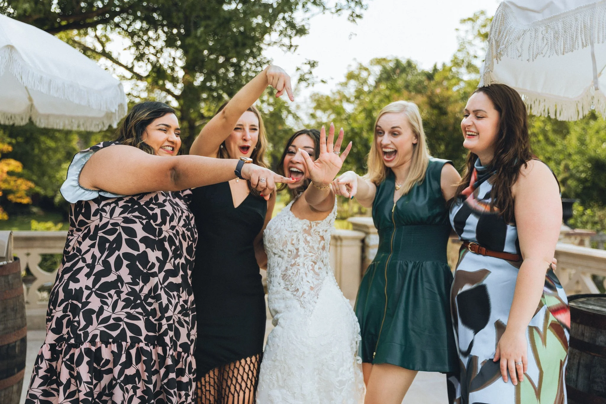 Bride laughing with her bridesmaids during cocktail hour at their outdoor wedding at Shiloh Manor Farm — photographed by Love Story By Aira Photography