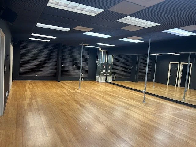 wood floor mirrored wall.jpeg