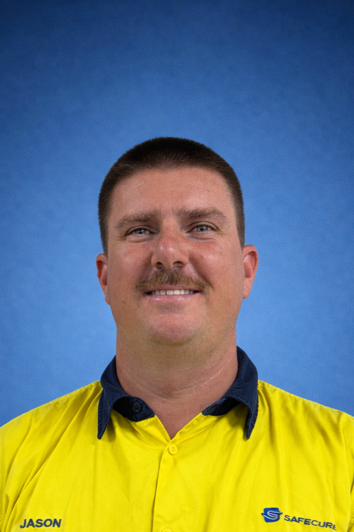 Man in yellow collared shirt against blue background