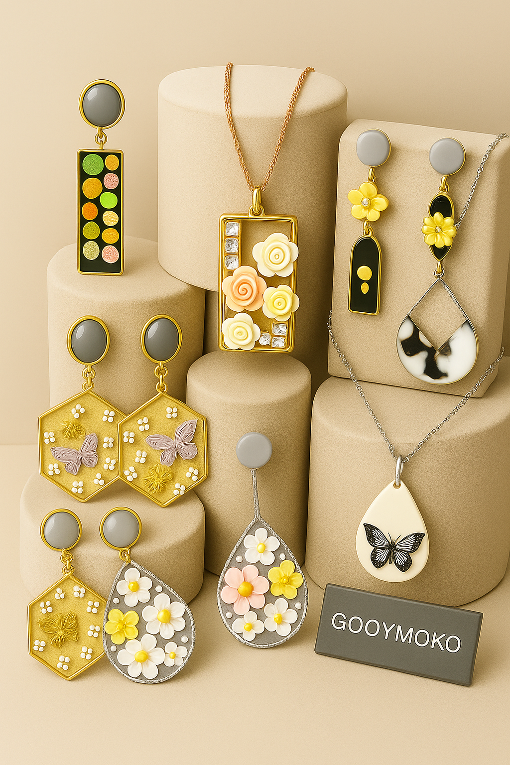 Collection of colorful, floral-themed earrings and necklaces displayed on beige blocks with a "GOOYMOKO" tag.