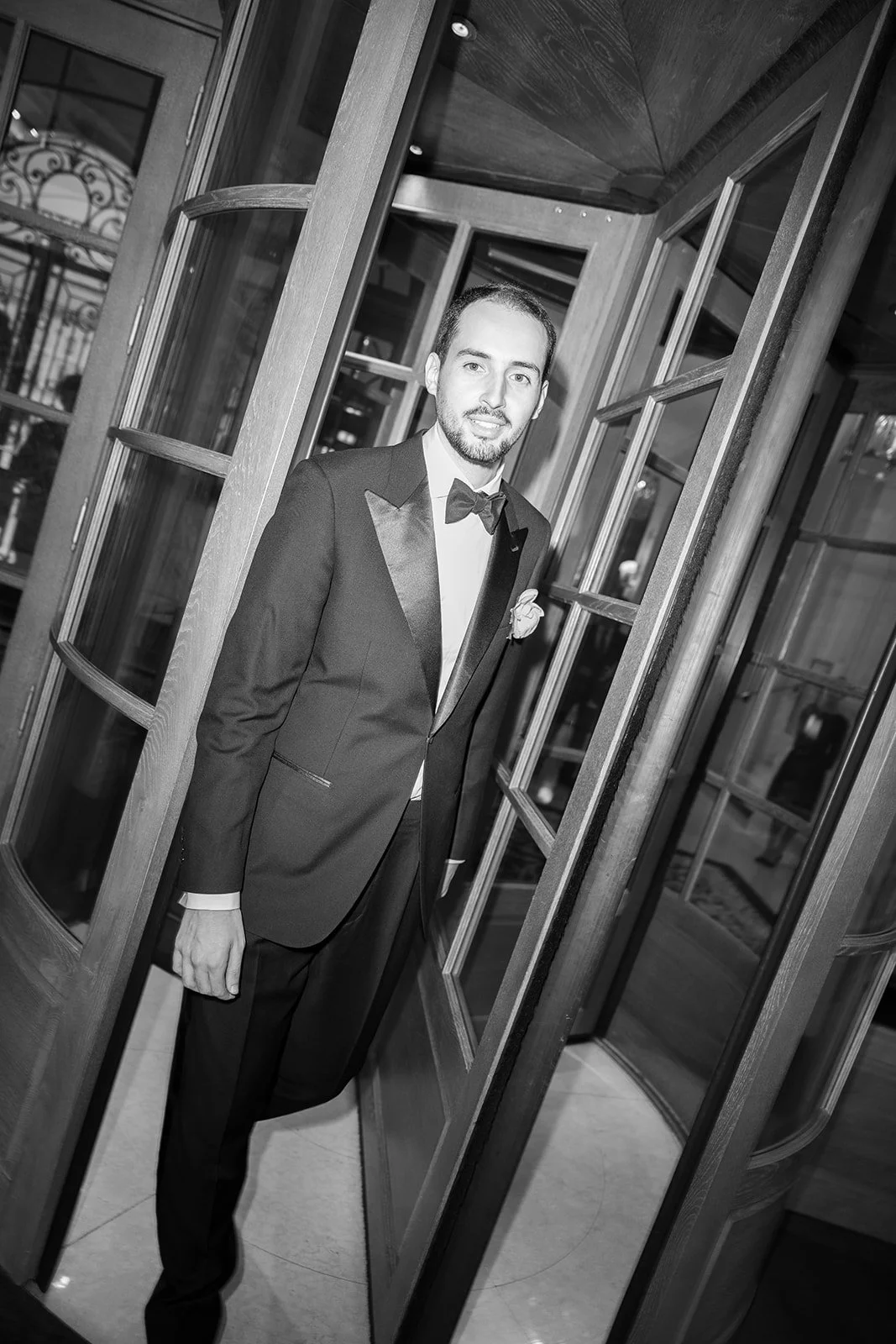 Fábio&amp;Jules-groom-smiling-entering-the-ritz-Paris