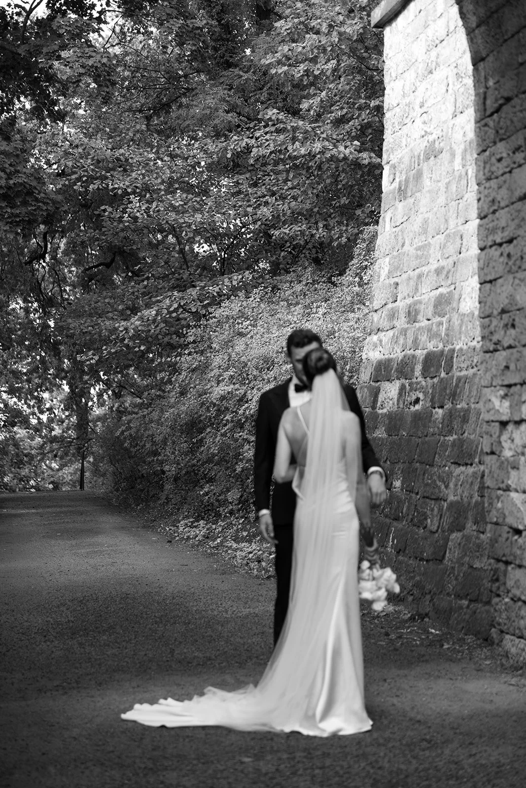Emotional wedding photography of the groom seeing his bride for the first time