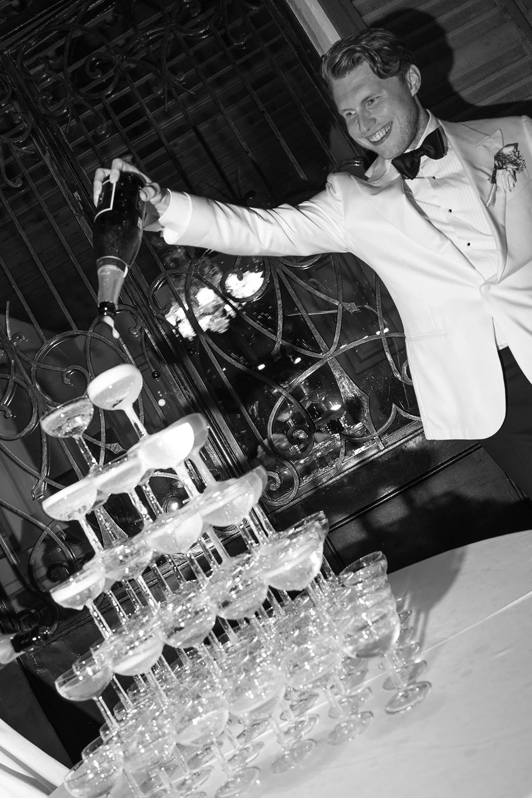 Fábio&amp;Jules_wedding-photos-mallorca-champagne-tower-groom-celebrating.jpg