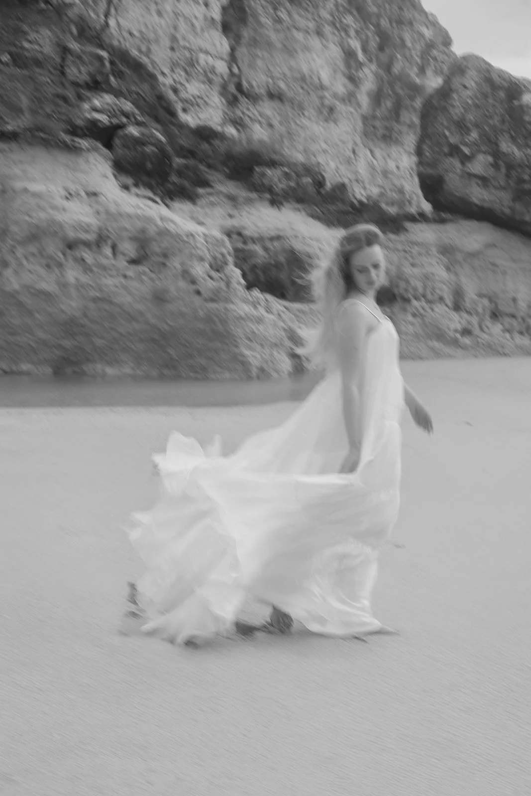 Windy beach couple photography with natural movement