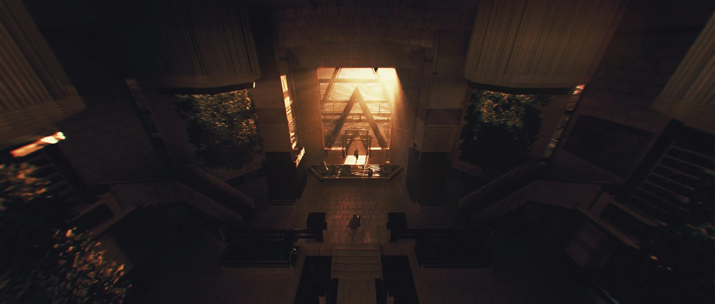 Looking down a staircase inside a building toward sunlight shining through an open doorway, with people walking in the distance.