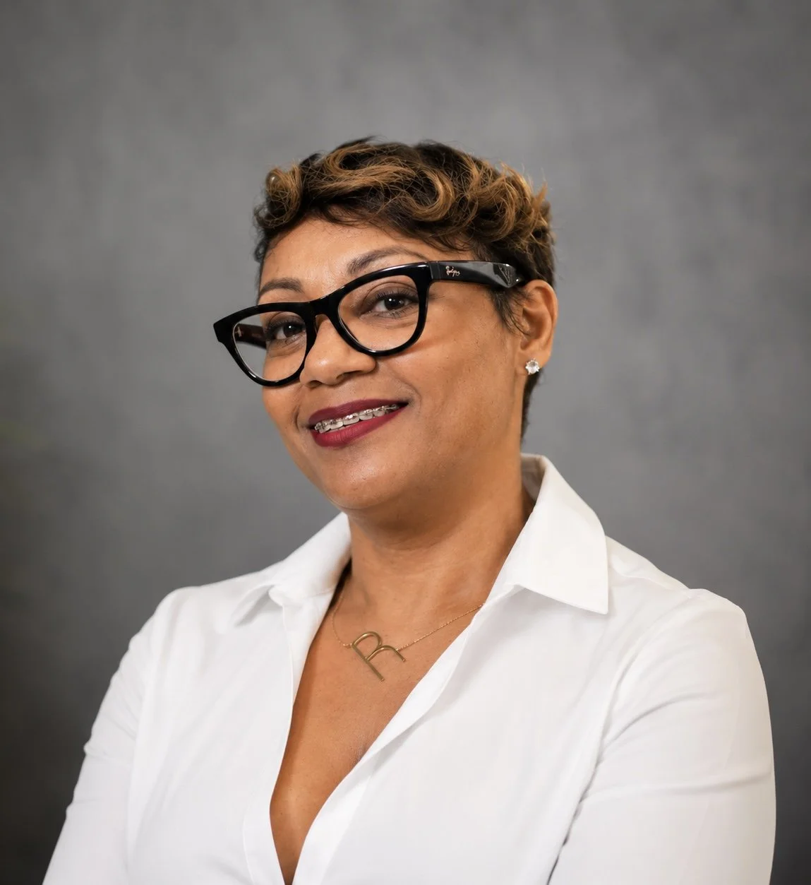 Headshot of Black Woman working a therapy practice