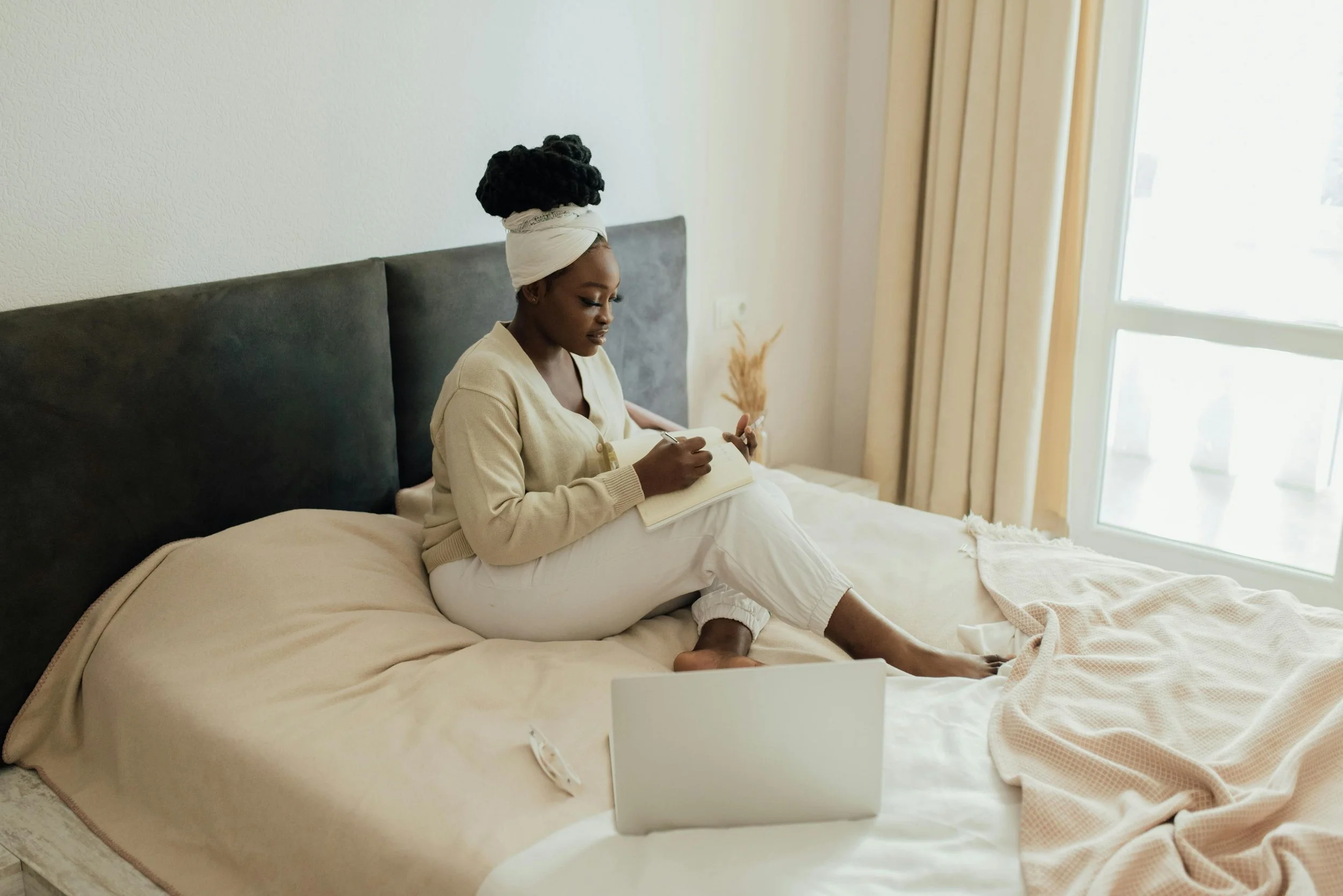 Black Woman Journaling Telehealth Therapy Appointment