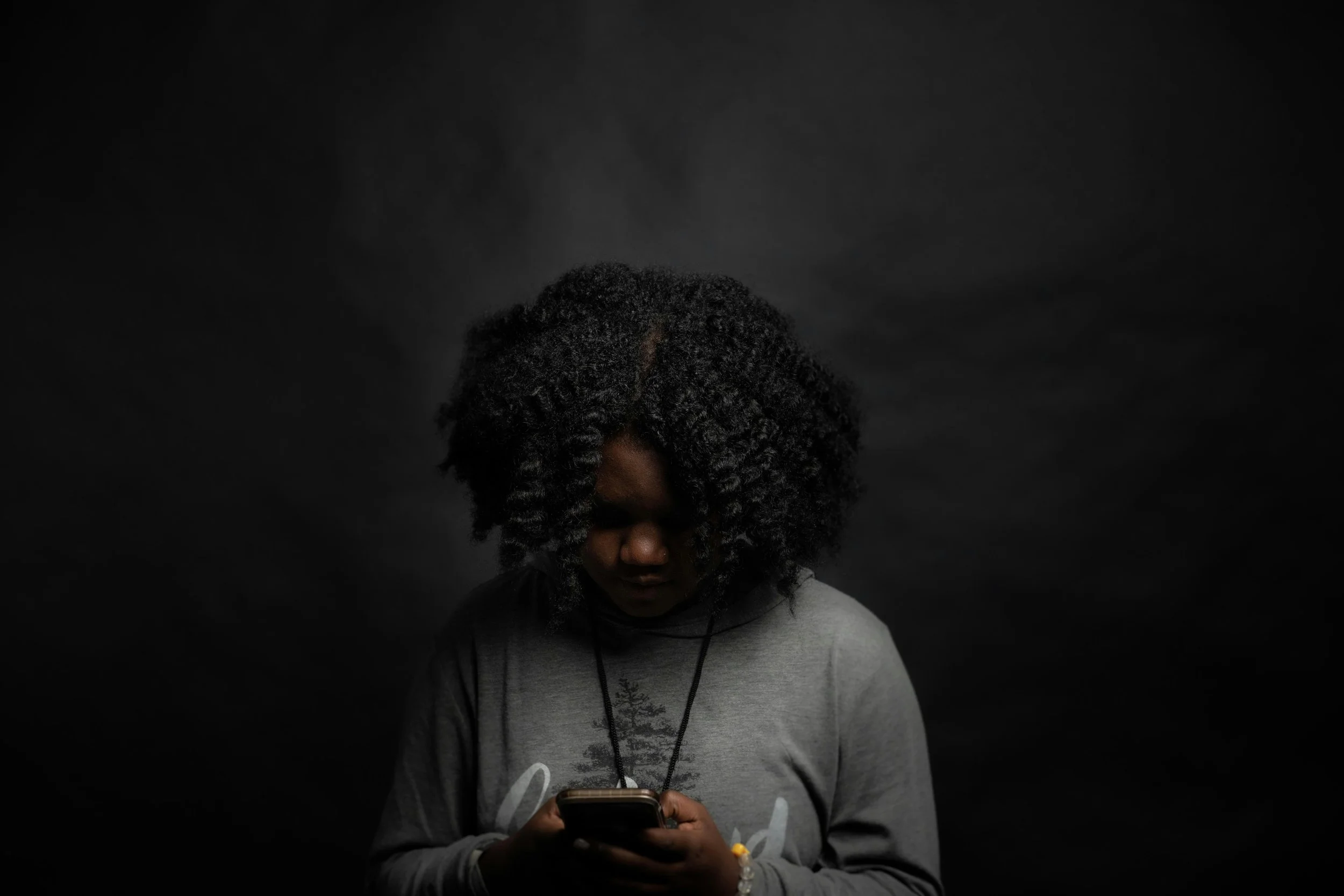 Black Woman on Phone Seeking Therapy