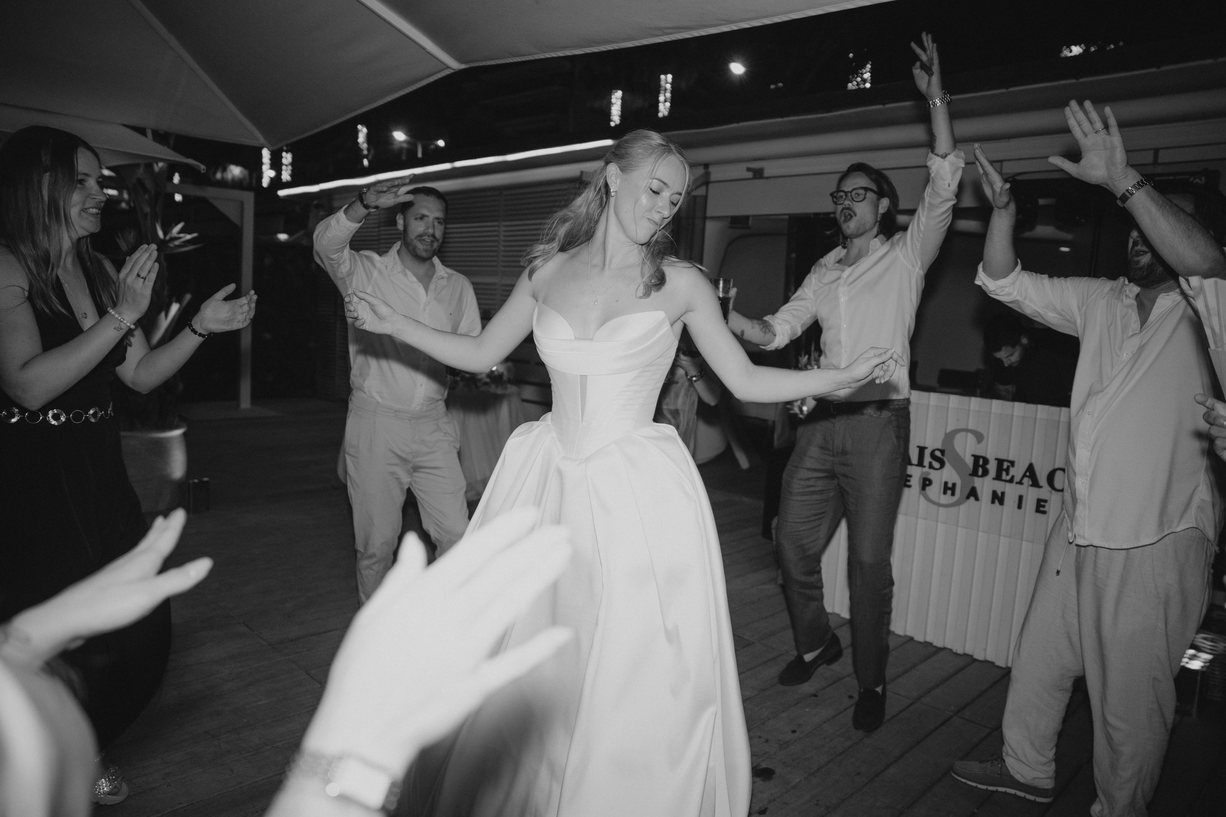 Luxury wedding dinner and reception by the Mediterranean Sea in Cannes, featuring elegant tablescape design, white florals, heartfelt speeches, candlelight, and an intimate celebration on the French Riviera.