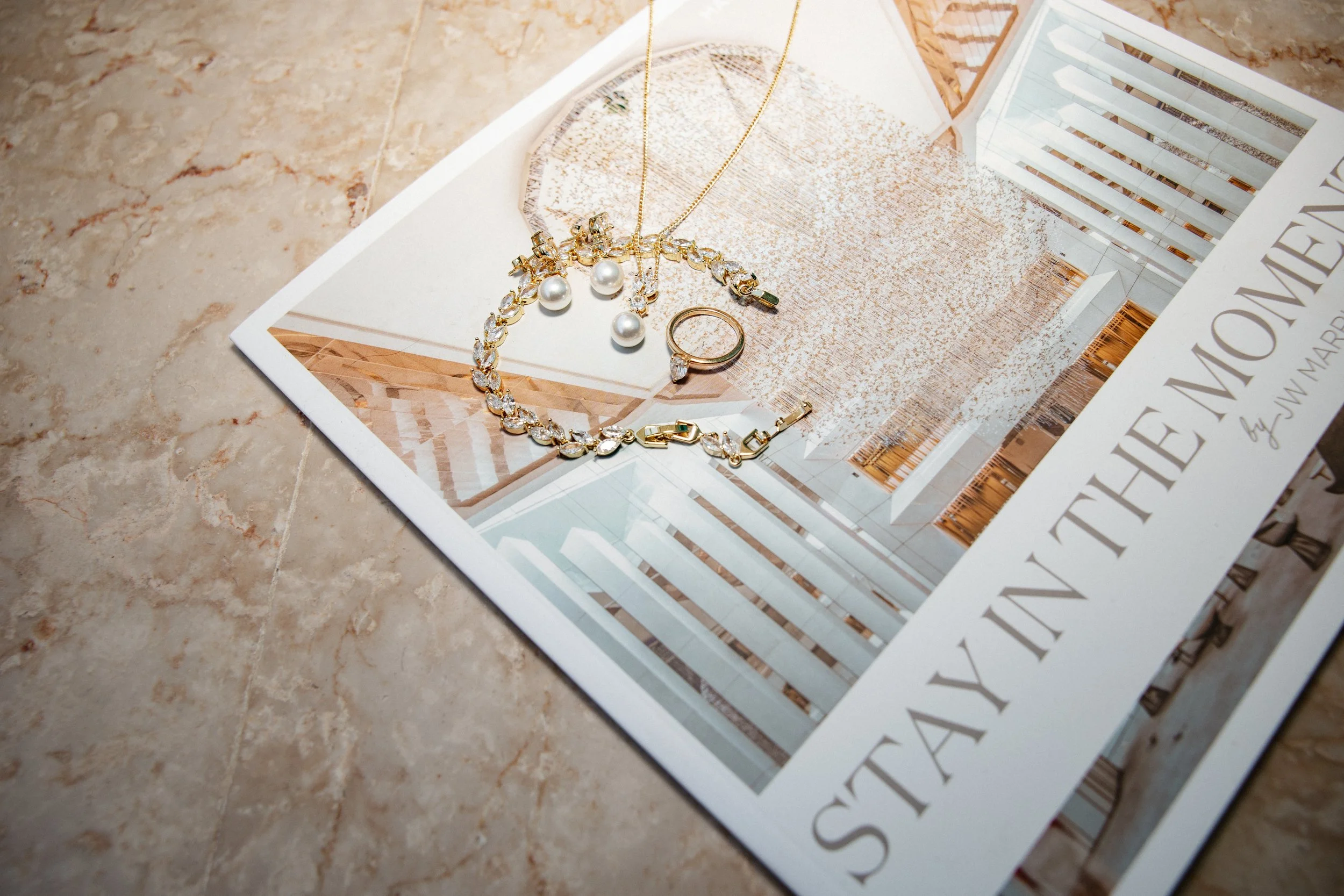 Luxury wedding getting ready at JW Marriott Cannes on the French Riviera, featuring the bride in her elegant Jarice Bridal gown, Christian Louboutin heels, refined bridal details, and a calm, modern wedding morning on the Côte d'Azur.