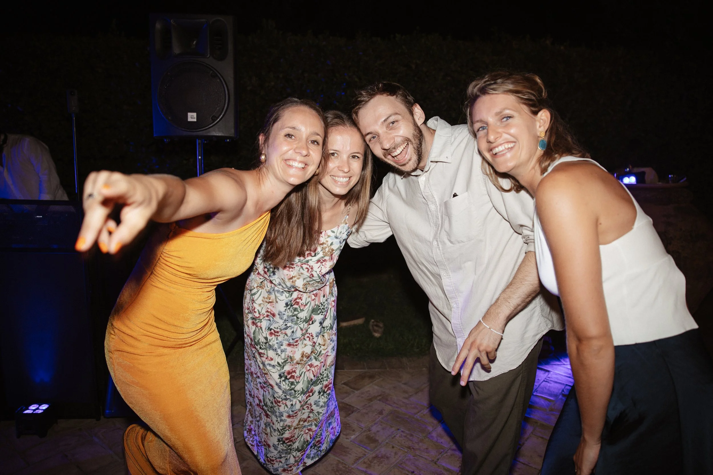 Selina, Jamie and their guests dancing, enjoying ice cream and jumping into the pool at Casale del Gallo during a relaxed Italian summer wedding party.