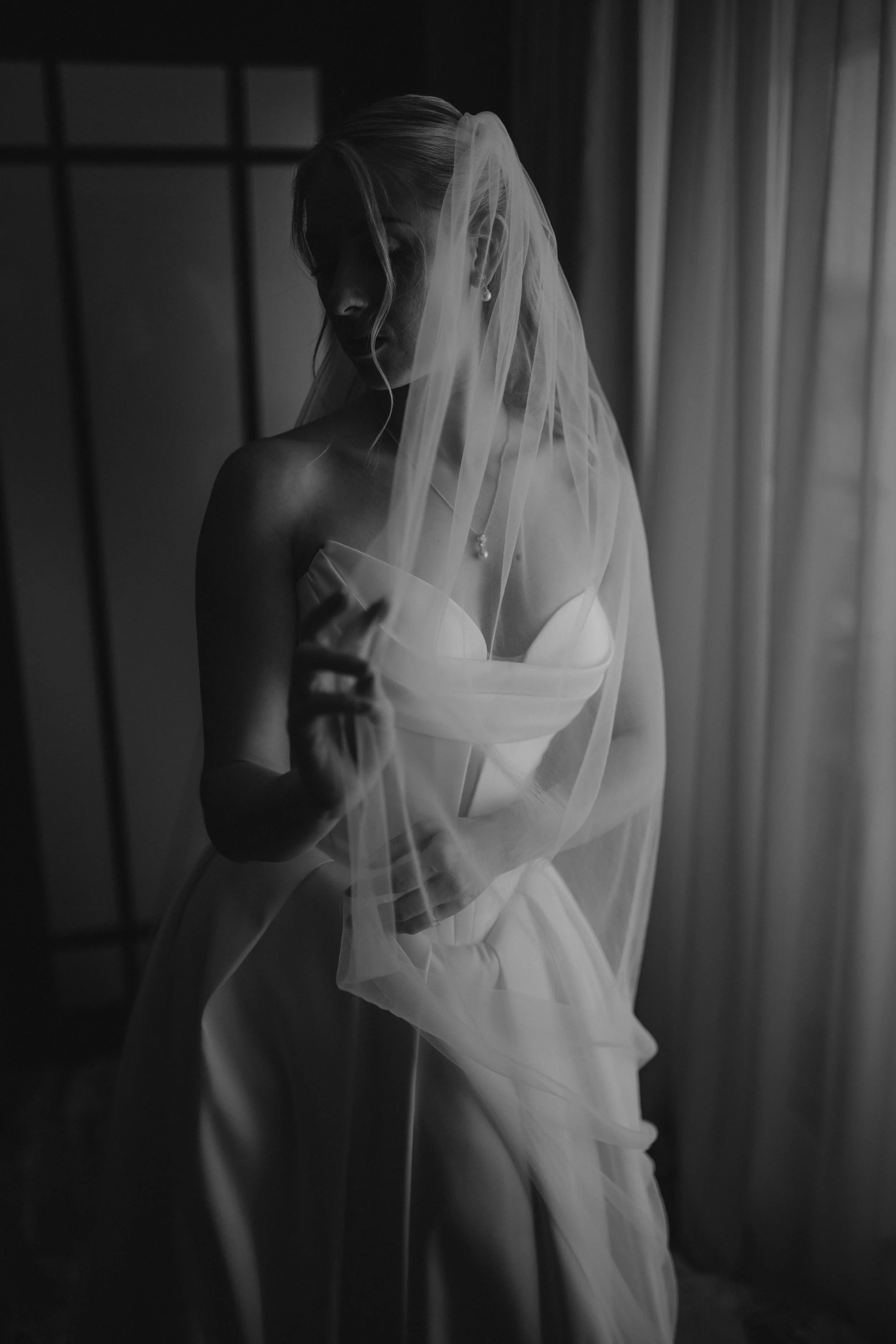 Luxury wedding getting ready at JW Marriott Cannes on the French Riviera, featuring the bride in her elegant Jarice Bridal gown, Christian Louboutin heels, refined bridal details, and a calm, modern wedding morning on the Côte d'Azur.